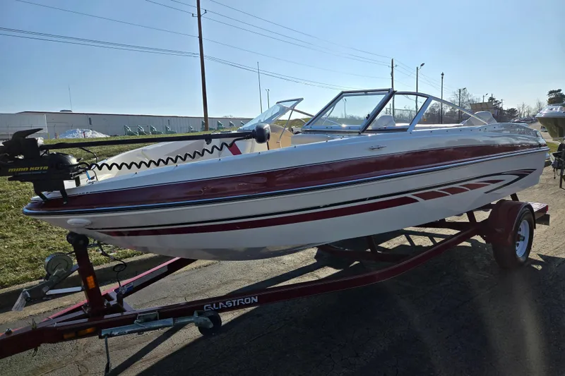 Slide: The Image of 2007 Glastron GT 205 Ski & Fish boat on trailer, featuring sleek design and red accents. - 6