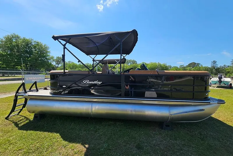 The Image of 2026 Bentley Pontoons Legacy 200 Navigator on grass under clear blue sky. - 1