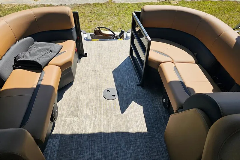 Slide: The Image of Interior of 2026 Bentley Pontoons Legacy 200 Navigator with tan seating and spacious layout. - 11