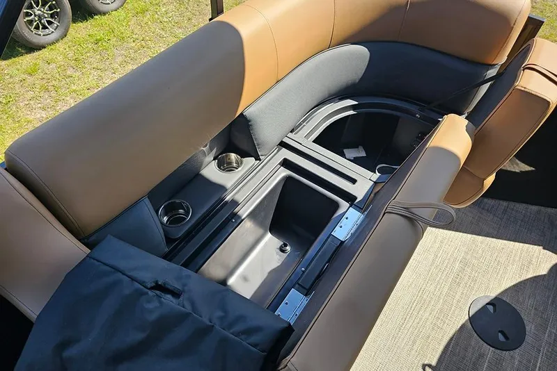 Slide: The Image of 2026 Bentley Pontoons Legacy 200 Navigator interior seating with storage and cup holders. - 13