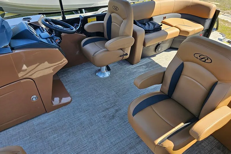 Slide: The Image of 2026 Bentley Pontoons Legacy 200 Navigator interior with luxurious tan seating and modern helm. - 15
