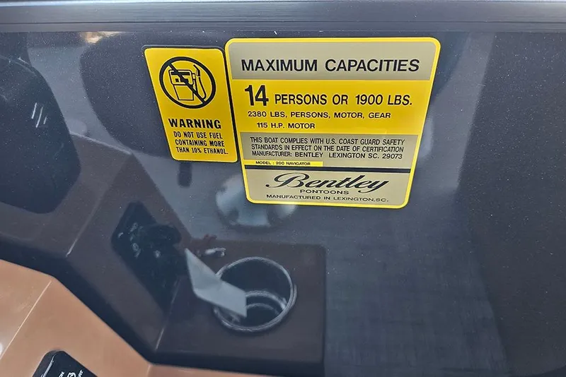 Slide: The Image of Warning label on 2026 Bentley Pontoons Legacy 200 Navigator, detailing maximum capacities. - 16
