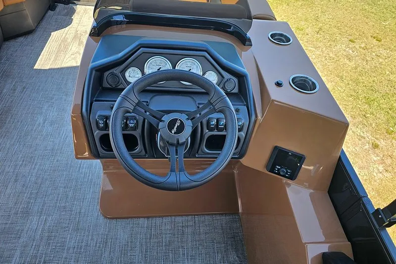 Slide: The Image of Steering console of 2026 Bentley Pontoons Legacy 200 Navigator with gauges and controls. - 17