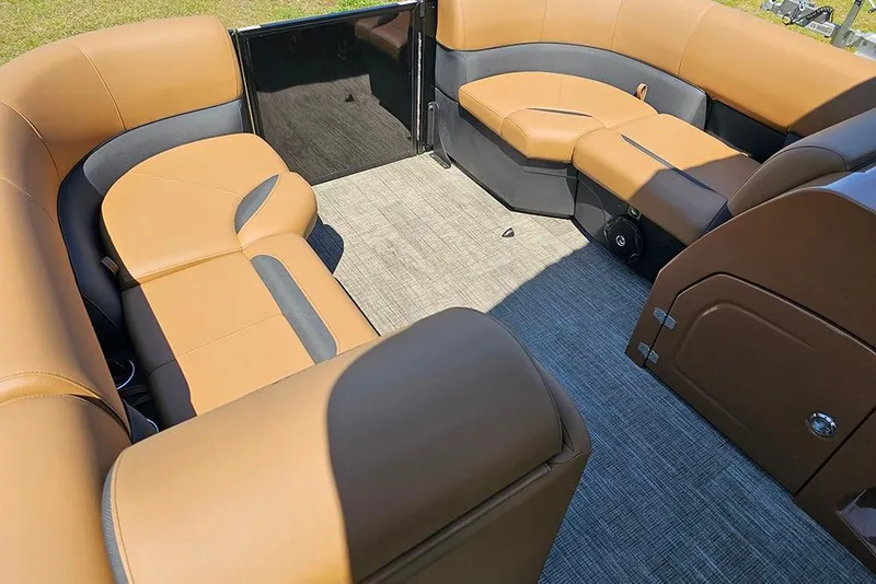 Slide: The Image of Luxurious interior of 2026 Bentley Pontoons Legacy 200 Navigator with tan and black seating. - 18