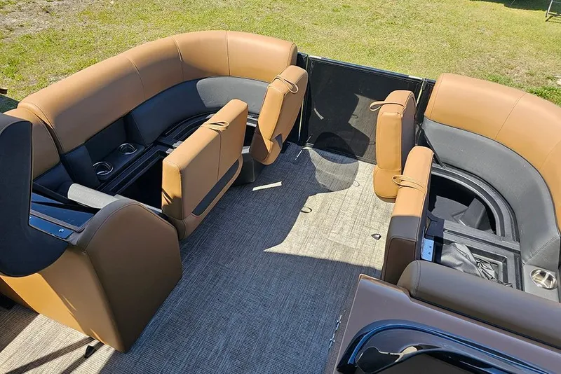 Slide: The Image of 2026 Bentley Pontoons Legacy 200 Navigator interior with tan and black seating. - 21
