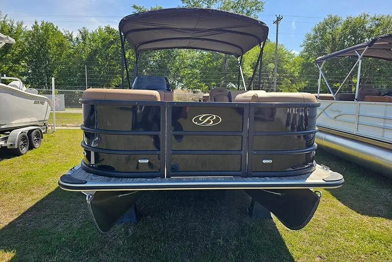 Slide: The Image of 2026 Bentley Pontoons Legacy 200 Navigator, black exterior, parked on grass, sunny day. - 4