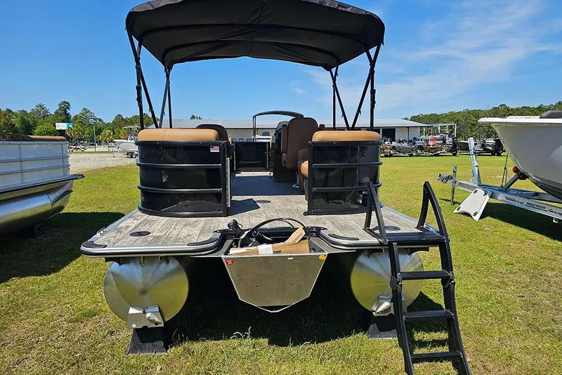 Slide: The Image of 2026 Bentley Pontoons Legacy 200 Navigator on grassy lot, showcasing rear view and seating. - 8