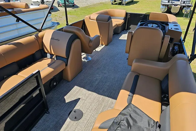 Slide: The Image of 2026 Bentley Pontoons Legacy 200 Navigator interior with tan seating and modern design. - 9