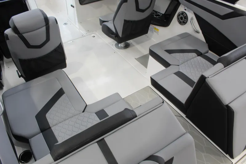 Slide: The Image of Interior of 2026 Yamaha Boats 222XD, featuring modern gray and black seating design. - 12