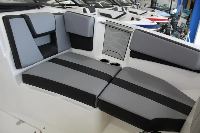 Slide: The Image of 2026 Yamaha Boats 222XD interior seating with sleek gray and black upholstery. - 8