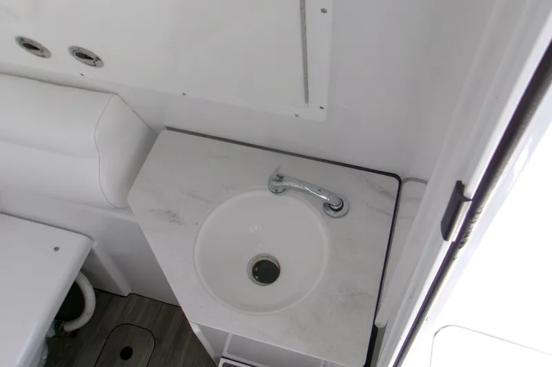 Slide: The Image of 2022 Sportsman Open 322 Center Console boat sink and countertop detail. - 14