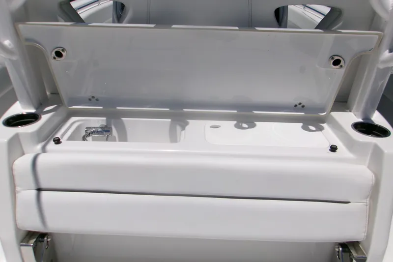 Slide: The Image of 2022 Sportsman Open 322 Center Console boat interior with storage compartment open. - 19