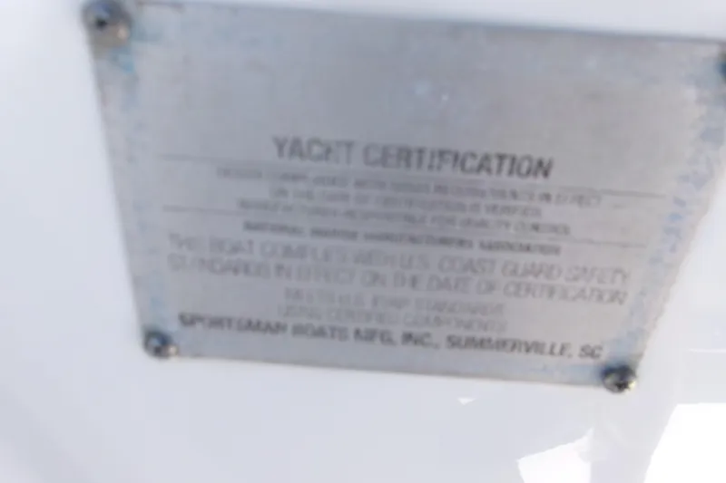 Slide: The Image of Yacht certification plaque on 2022 Sportsman Open 322 Center Console boat. - 22
