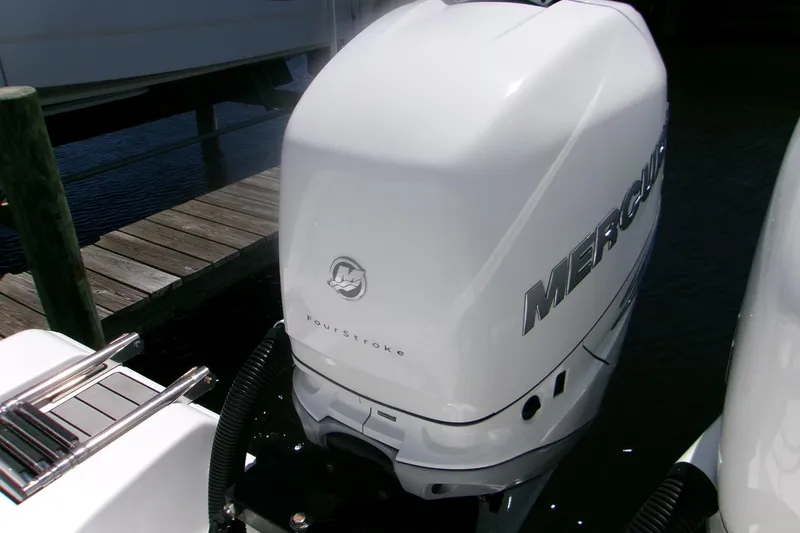 Slide: The Image of 2022 Sportsman Open 322 Center Console with Mercury FourStroke engine at dock. - 25