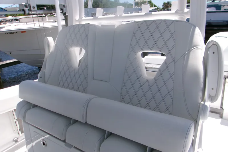 Slide: The Image of 2022 Sportsman Open 322 Center Console boat seating with diamond-stitched upholstery. - 3