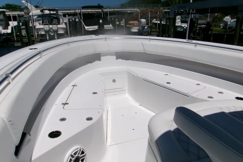 Slide: The Image of 2022 Sportsman Open 322 Center Console boat interior with spacious seating and storage. - 4