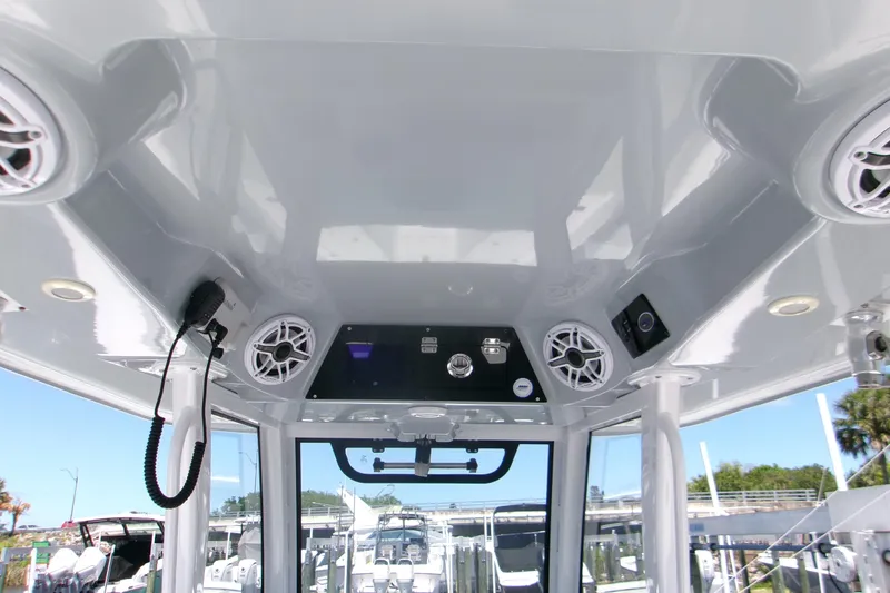 Slide: The Image of 2022 Sportsman Open 322 Center Console boat interior with speakers and control panel. - 7