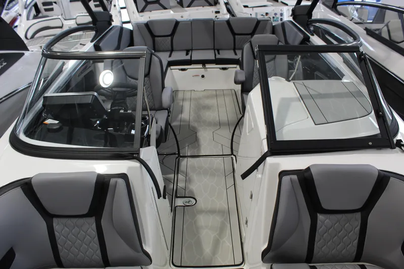 Slide: The Image of 2026 Yamaha Boats 255XE interior with sleek seating and modern design. - 14