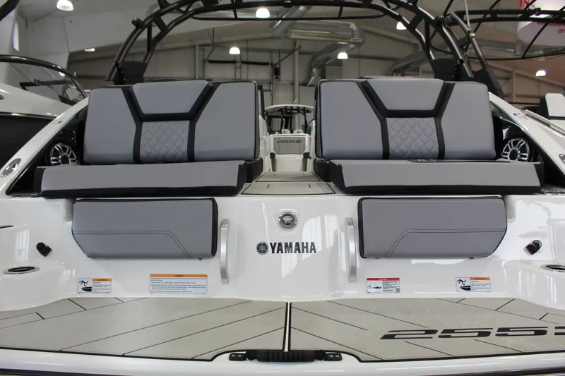 Slide: The Image of 2026 Yamaha Boats 255XE interior with gray seating and modern design. - 2