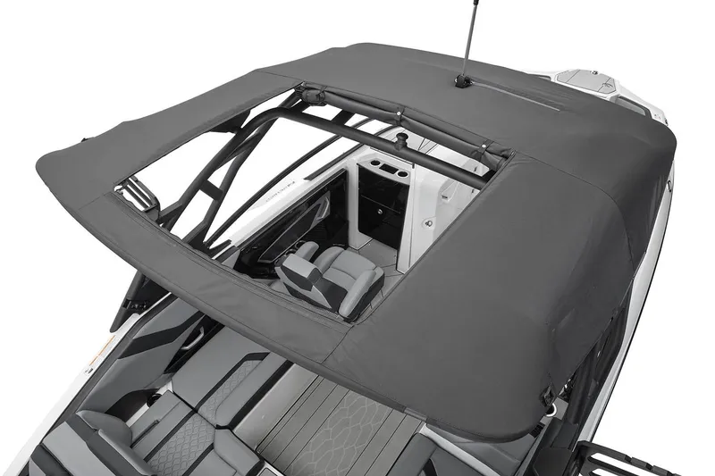 Slide: The Image of Manufacturer Provided Image: 2026 Yamaha Boats 255XE with canopy, showcasing interior seating and design. - 29