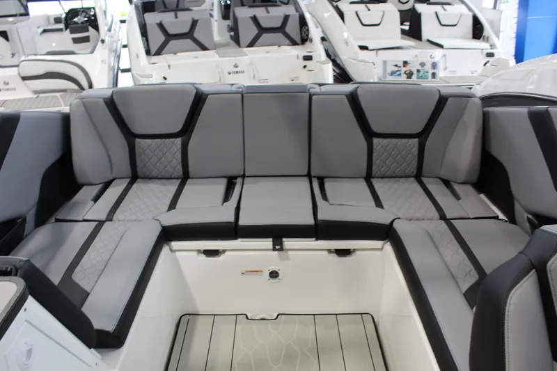 Slide: The Image of 2026 Yamaha Boats 255XE interior with sleek gray seating and modern design. - 4