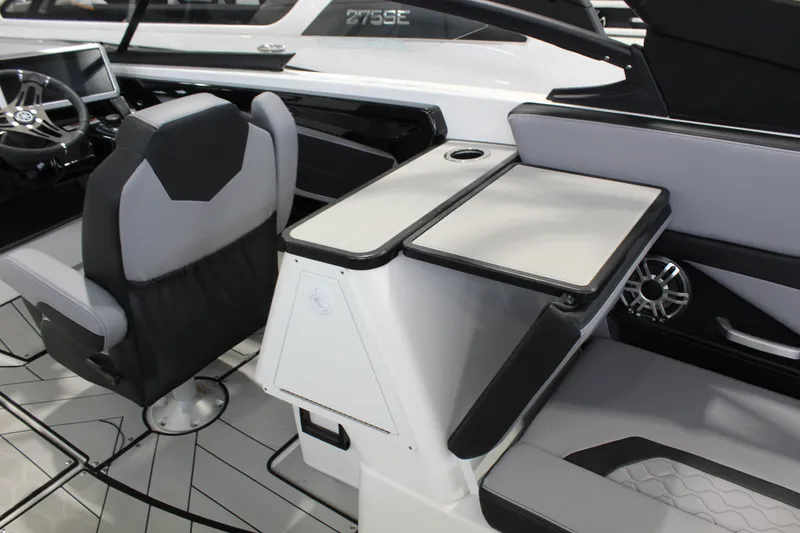 Slide: The Image of 2026 Yamaha Boats 255XE interior with sleek seating and modern dashboard design. - 6