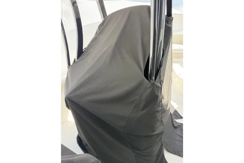 Slide: The Image of Covered console of a 2022 Seapro 239 DLX boat with protective fabric. - 10
