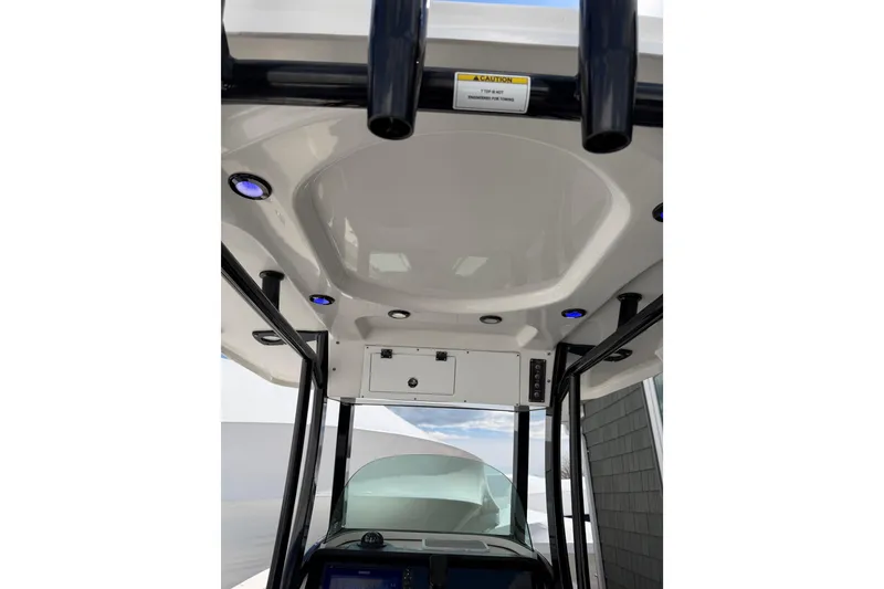 Slide: The Image of 2022 Seapro 239 DLX boat interior with modern roof design and lighting. - 14