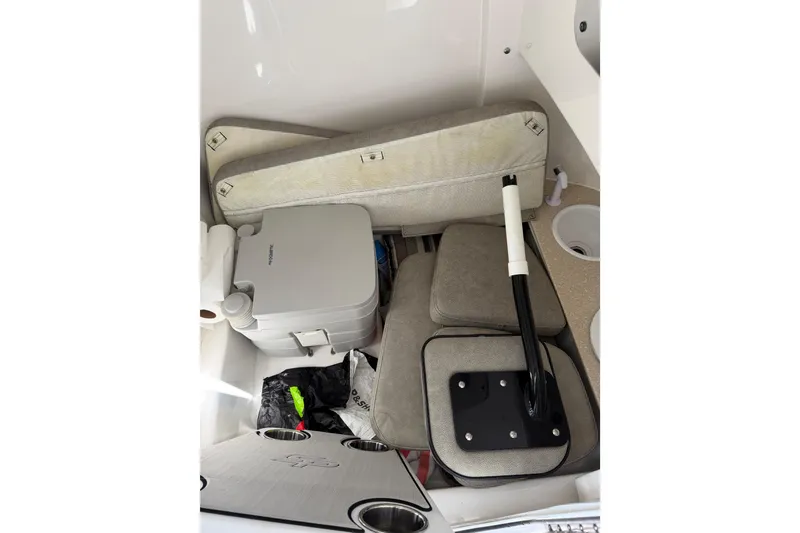 Slide: The Image of Interior storage of 2022 Seapro 239 DLX boat with cushions and portable toilet. - 24