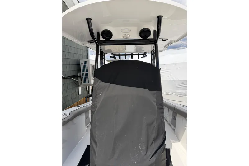 Slide: The Image of 2022 Seapro 239 DLX boat interior with covered console and T-top. - 4
