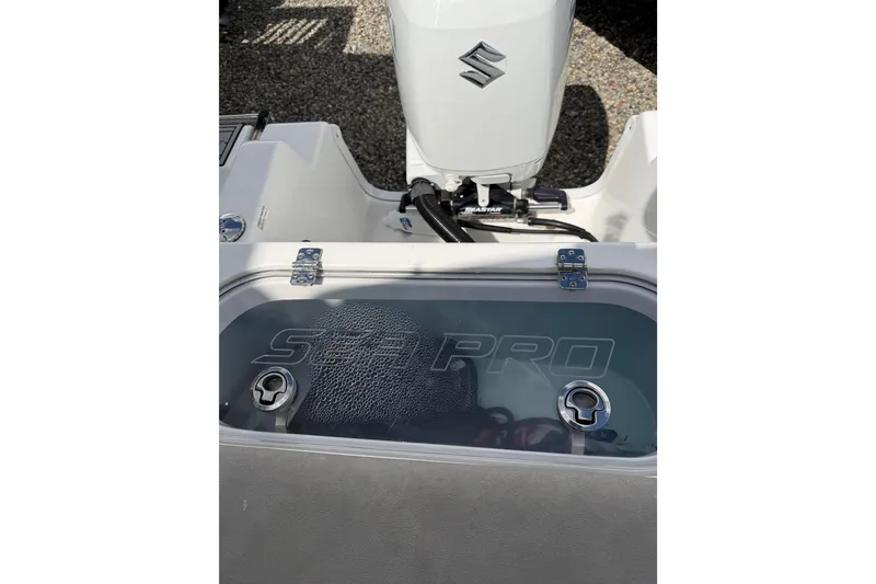 Slide: The Image of 2022 Seapro 239 DLX boat with Suzuki engine and Seapro logo on deck. - 7