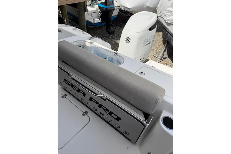 Slide: The Image of 2022 Seapro 239 DLX boat interior with seating and Suzuki outboard motor. - 8