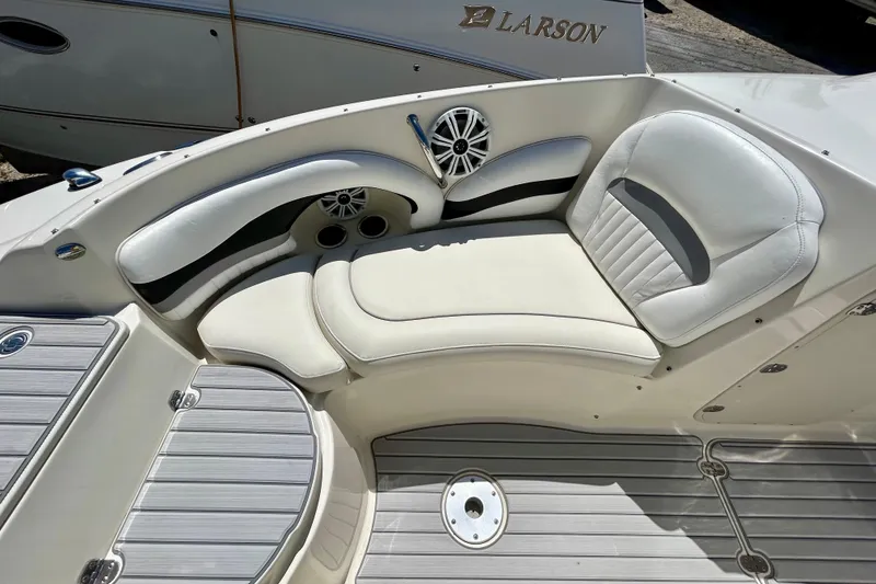 Slide: The Image of Interior seating of a 2012 Stingray 234 LR boat with white upholstery. - 14