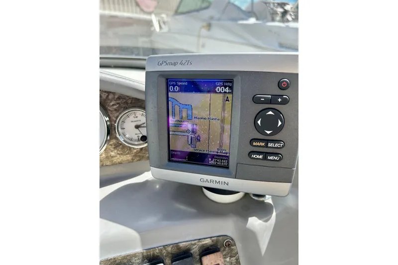 Slide: The Image of Garmin GPSmap 421s on 2012 Stingray 234 LR boat dashboard, displaying navigation details. - 19
