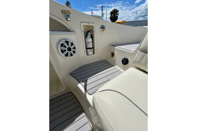 Slide: The Image of Interior of 2012 Stingray 234 LR boat with speaker and fire extinguisher. - 20