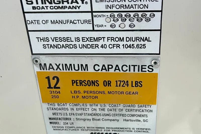 Slide: The Image of 2012 Stingray 234 LR capacity plate, max 12 persons or 1724 lbs, USCG compliant. - 21