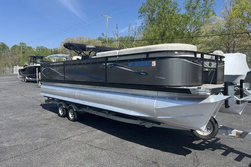 The Image of 2023 Angler Qwest 8524 Pro Family Fish Triple Tube pontoon boat on trailer. - 1