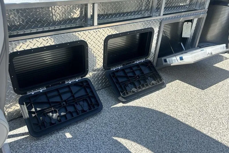 Slide: The Image of Storage compartments on a 2023 Angler Qwest 8524 Pro Family Fish Triple Tube boat. - 16