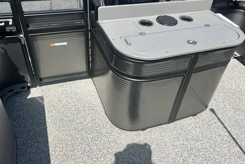 Slide: The Image of 2023 Angler Qwest 8524 Pro Family Fish Triple Tube boat interior with storage compartment. - 18