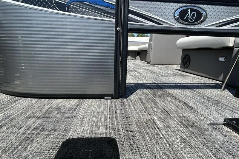 Slide: The Image of 2023 Angler Qwest 8524 Pro Family Fish Triple Tube boat interior with textured flooring. - 19