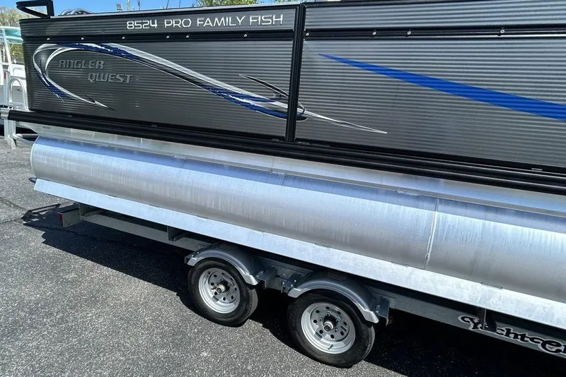 Slide: The Image of 2023 Angler Qwest 8524 Pro Family Fish Triple Tube on trailer, side view. - 3