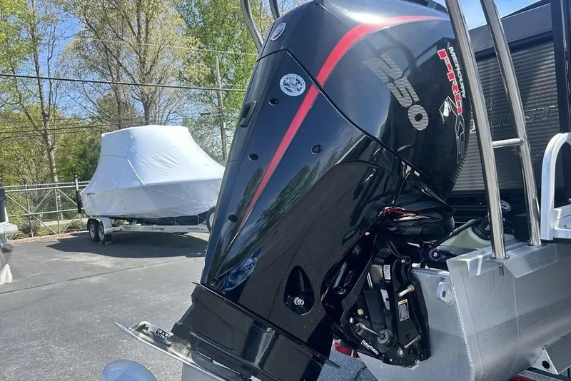 Slide: The Image of 2023 Angler Qwest 8524 Pro Family Fish Triple Tube with powerful outboard motor. - 4