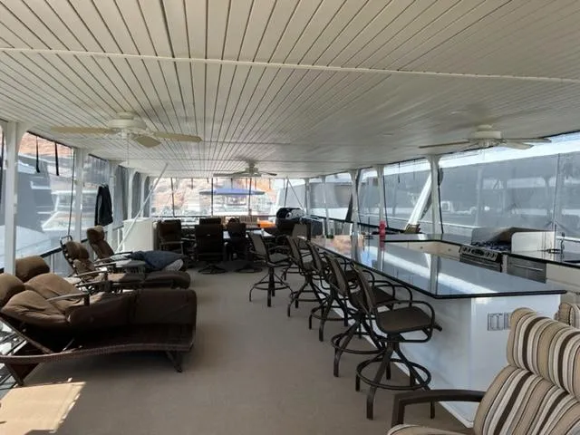 Slide: The Image of Spacious 2007 Sumerset Fellowship Share #5 houseboat interior with seating and kitchen area. - 3