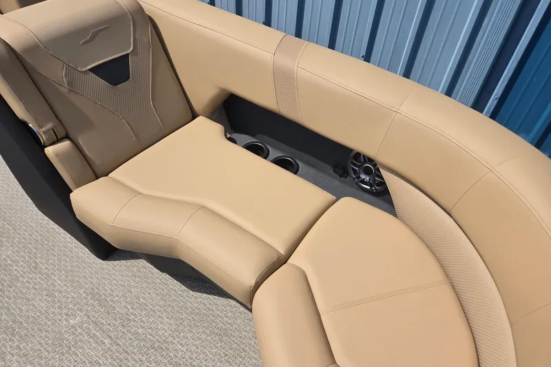 Slide: The Image of Luxurious beige seating in 2026 Evotti 523QL boat, featuring cup holders and speaker. - 12