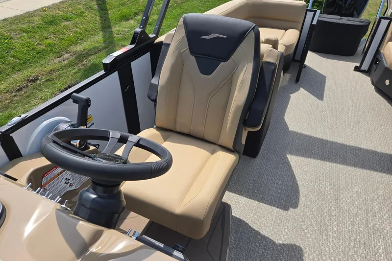 Slide: The Image of 2026 Evotti 523QL boat interior with beige seating and steering wheel. - 15