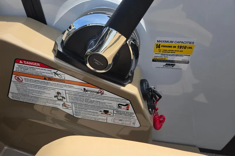 Slide: The Image of Throttle control and safety warnings on 2026 Evotti 523QL boat, capacity 14 persons or 1910 lbs. - 20