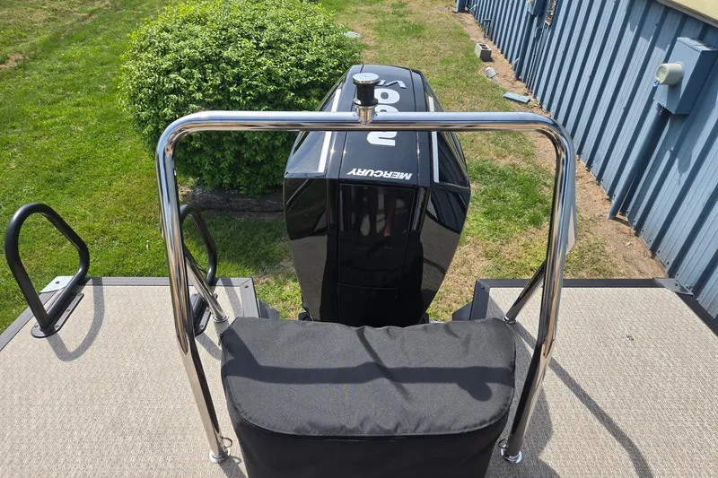 Slide: The Image of Rear view of a 2026 Evotti 523QL boat with Mercury outboard motor. - 24