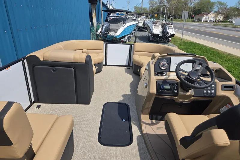 Slide: The Image of Interior of 2026 Evotti 523QL boat with beige seating and modern dashboard. - 30