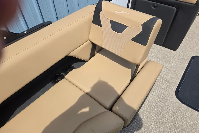 Slide: The Image of Luxurious beige seating in 2026 Evotti 523QL boat, featuring cup holders and modern design. - 32