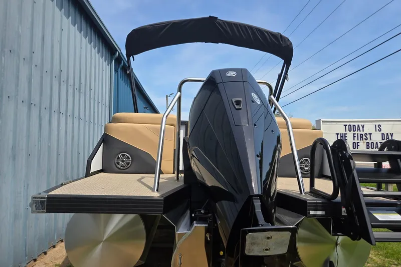 Slide: The Image of 2026 Evotti 523QL boat with sleek design, docked near a blue building. - 43